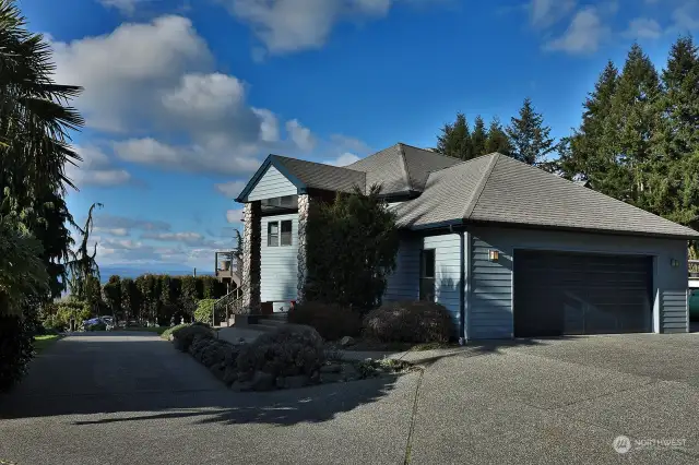 Two-car garage, mature landscaping, and located at the end of the road.