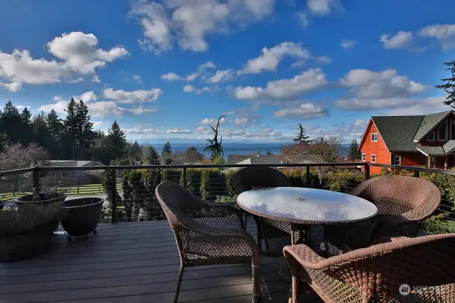 A quick step out onto the deck to breathe in some sea air. Newer deck has sleek cable railings maximizing your view.