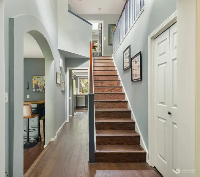 You can see the kitchen at the very end of the hallway.  Stairs to second level.  All bedrooms and bonus room/office are on the second floor. Beautiful flooring and finishes throughout.