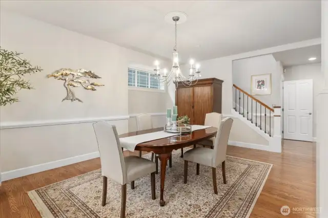 Light filled entry welcomes you with high ceilings, beautiful millwork and gleaming hardwoods.