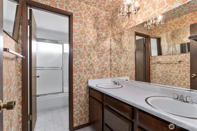 Guest bath is a full bath with double sinks.