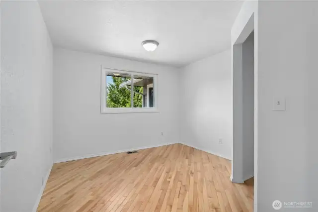 Bedroom #3 with wood flooring.