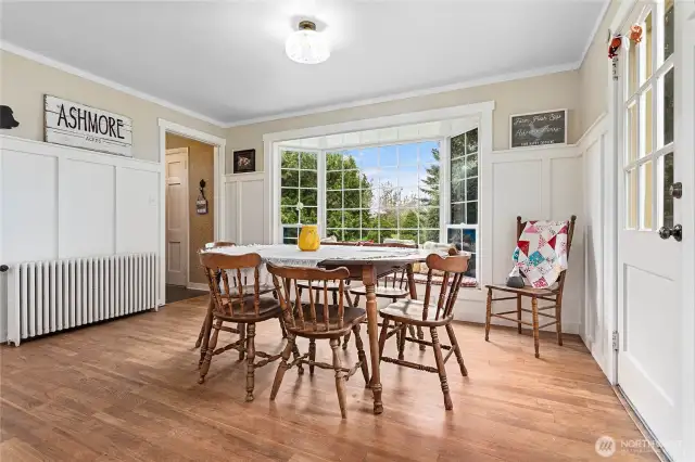 Picture perfect bay window with bench seating looks out toward the front of the home.