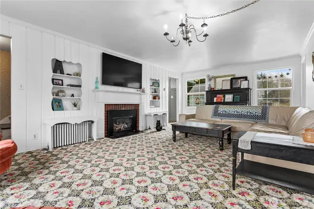 Charming built-ins flank the cozy fireplace.