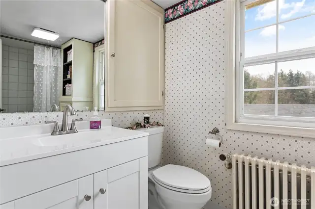 One full bathroom upstairs which has a large built-in medicine cabinet and additional linen cabinet.