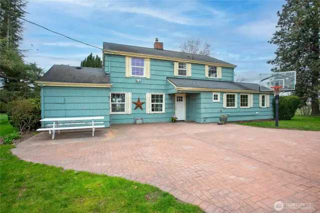 Large rear patio area great for activities, gatherings or shooting hoops!