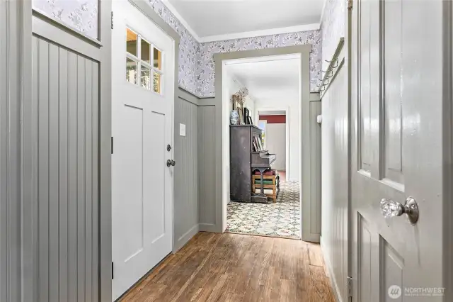 The every-day entry is from the back of the home where you are greeted with beautiful hardwoods and recently updated wainscoting and wallpaper.