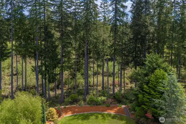 Backs to the greenspace, that goes beyond the landscaping with views of the golf course, serene and private with no fencing allowed, offering uninterrupted natural views