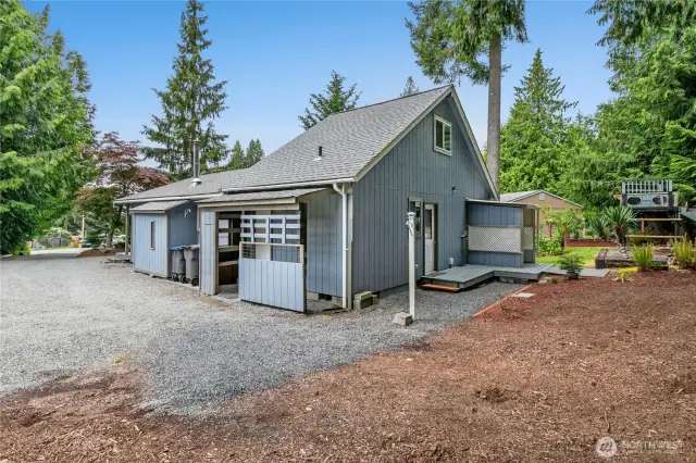 side of home with room for a shop