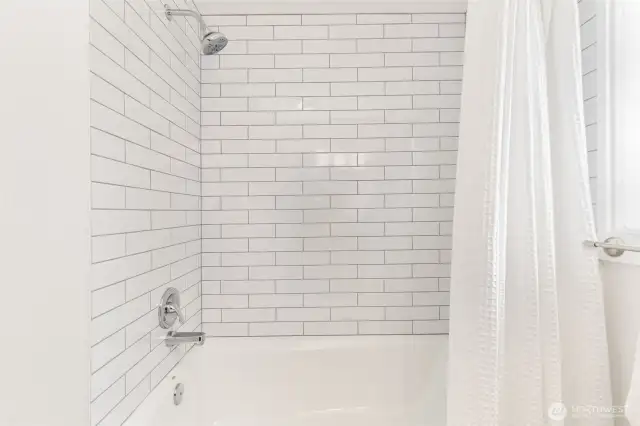 Upstairs bath with new shower tile