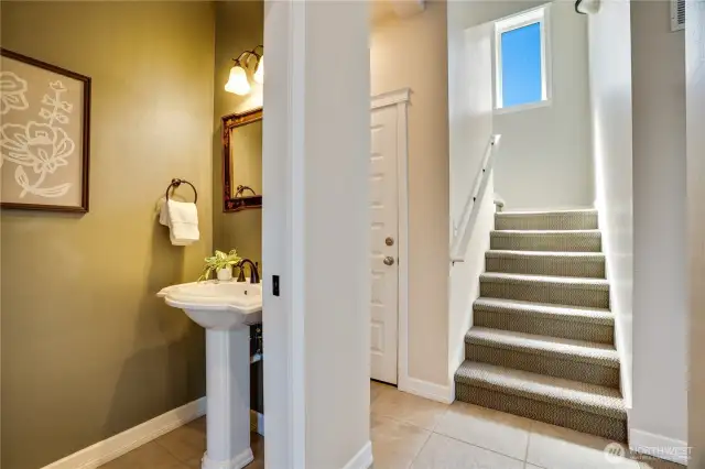 Half bath on main for guests and upstairs to the bedroom suites and view deck