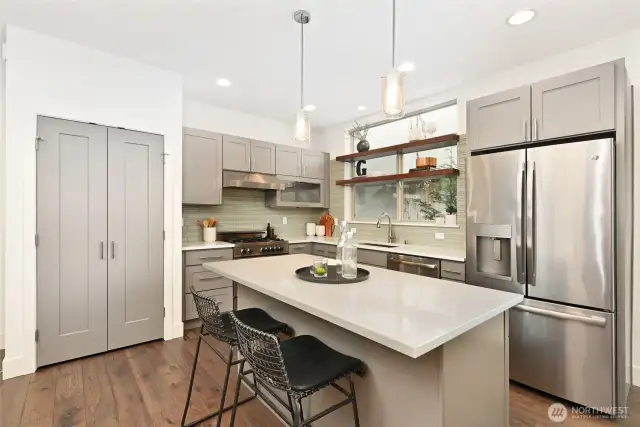 Kitchen has center island and pantry.