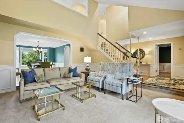 Designed for both elegance and functionality, this thoughtfully arranged space offers effortless flow between the living room, formal dining area, and dedicated home office. Expansive windows flood the space with natural light, highlighting the refined architectural details and sophisticated neutral tones throughout. The formal dining room provides a warm and inviting setting for gatherings, while the private home office delivers a quiet, productive workspace. Blending comfort and practicality, this beautifully designed area is ideal for entertaining, working, and everyday living.
