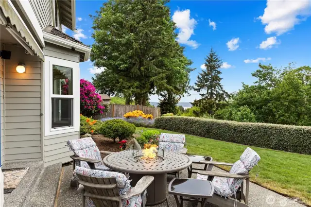 Perfectly positioned to take in the stunning natural surroundings, this inviting patio overlooks a peaceful greenbelt with a glimpse of Puget Sound beyond. Thoughtfully designed for seamless indoor-outdoor living, the space offers a relaxing setting for morning coffee, evening gatherings, or quiet reflection.