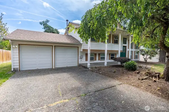 This home comes with a two-car attached garage and ample driveway parking.