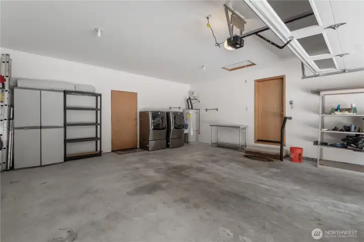 Two car garage with with high ceilings and lots of storage opportunities.