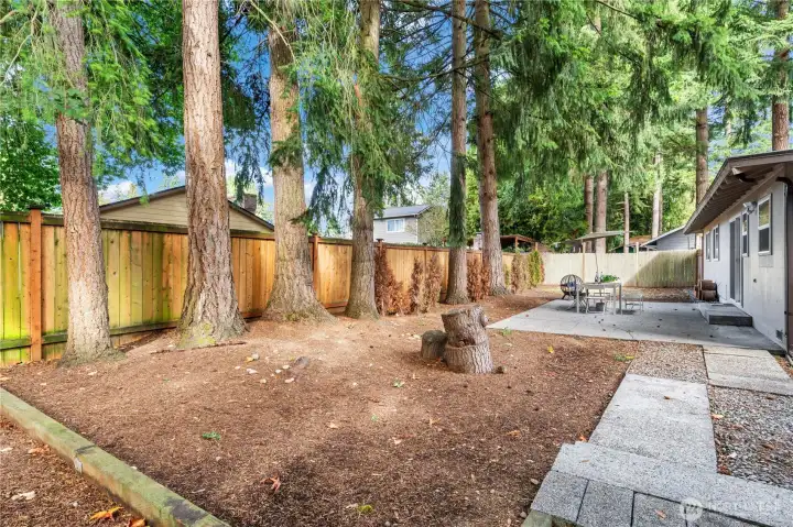 Level lot, no slope, with lots of privacy.
