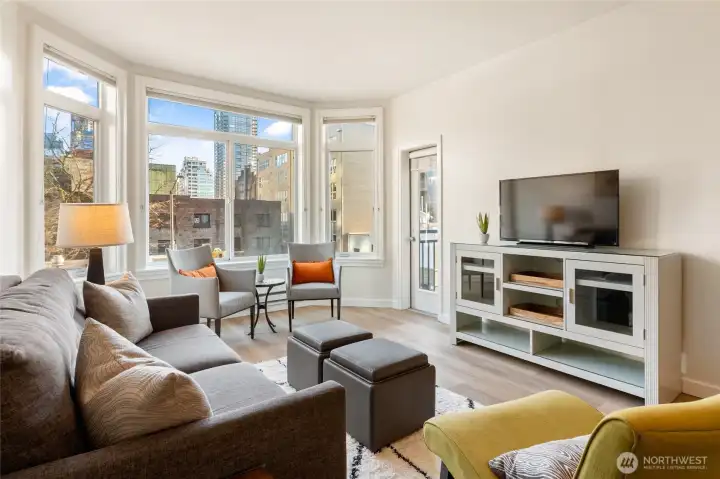 Brand new LVP floors and fresh paint sparkle in the sunlight.