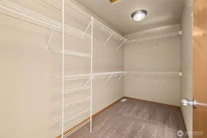 Primary bedroom walk-in closet