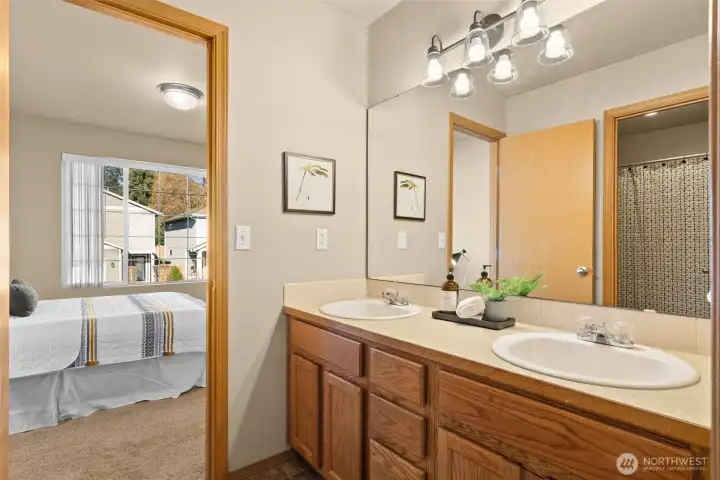 Dual sink bathroom connected to 2nd and 3rd bedroom