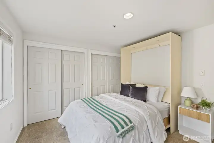 Secondary Bedroom features Wall of Closets