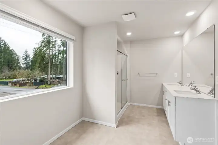 Well-appointed primary bathroom with modern finishes.