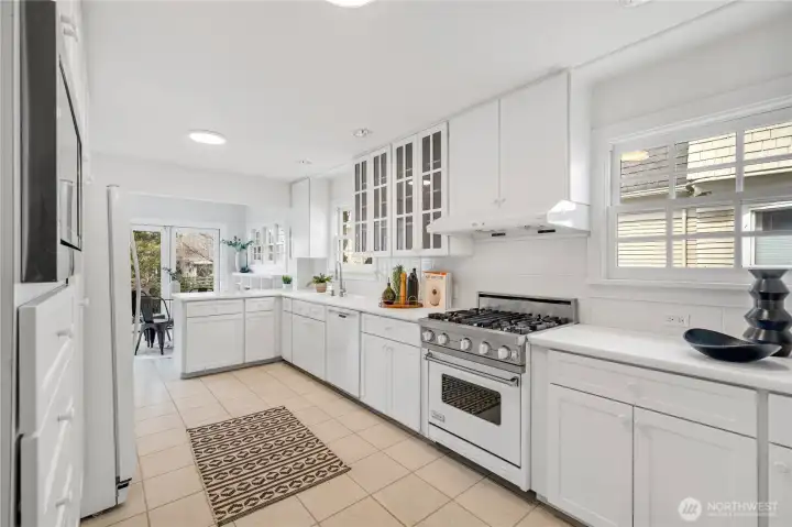 Well-appointed kitchen with generous storage, Viking range, built-in microwave, and plenty of cabinetry. Situated north of the dining room and east of the sunroom. An effortless layout for entertaining.