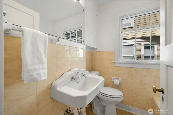 Main floor full bath spotlessly maintained with original character beautifully preserved.
