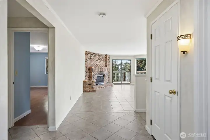 Our journey begins in the foyer with a half bath on the right and 2 en suite bedrooms on the left. We'll come back to those after we explore the rest of the main floor.