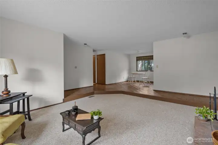 Sunken living room overlooking the dining room.