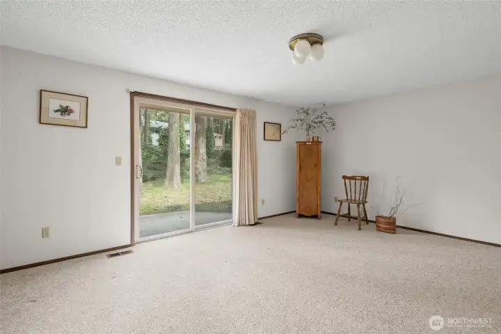 Spacious family room with sliding glass door to backyard.