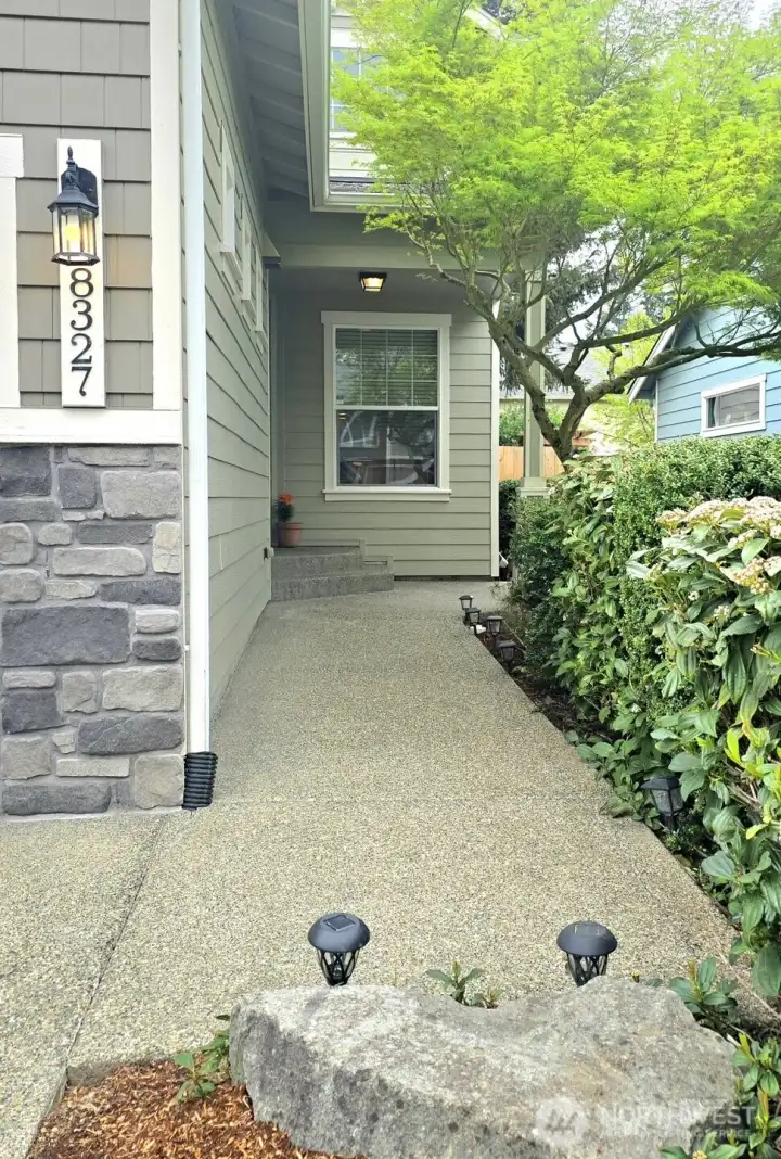 Walk up the nicely landscaped path to the front door