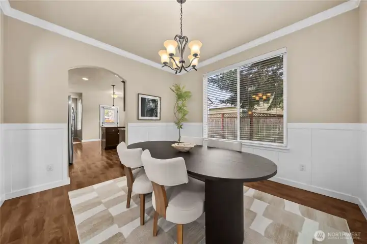 Another curved archway leads to the kitchen