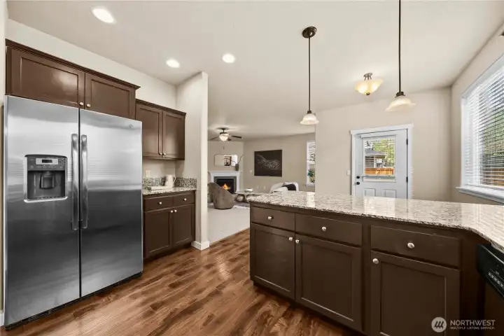 stainless-steel appliances and a breakfast counter