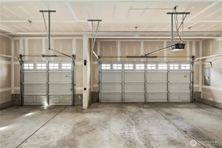 A spacious 3-car garage with room for tools, toys and vehicles