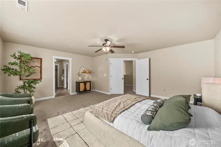 French doors open to this very large primary bedroom