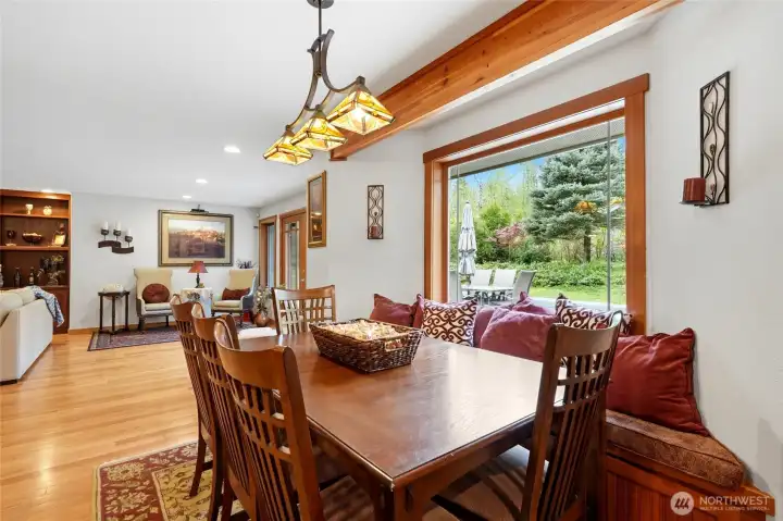 Dining space with access to outdoor deck nearby.