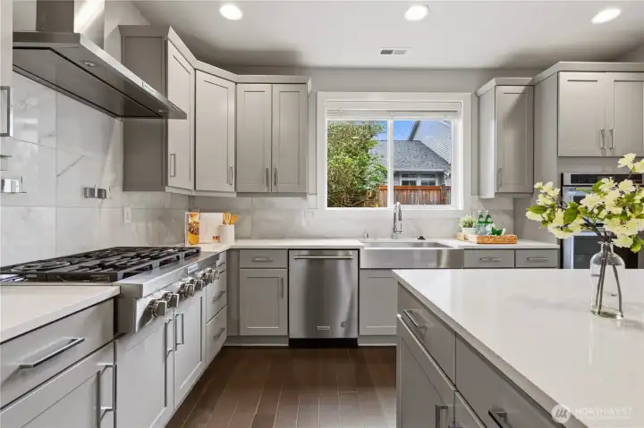 Kitchen with quartz countertops and stainless steel appliances