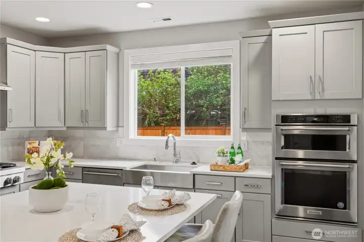 Kitchen with quartz countertops and stainless steel appliances