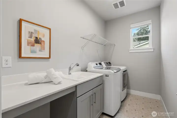 Laundry room with sink, washer and dryer, and counter space