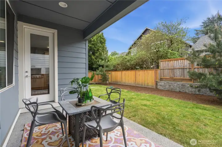 Private backyard with covered patio and garden space