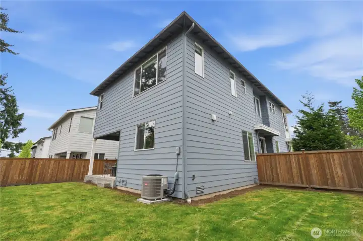 Fully fenced yard with lawn