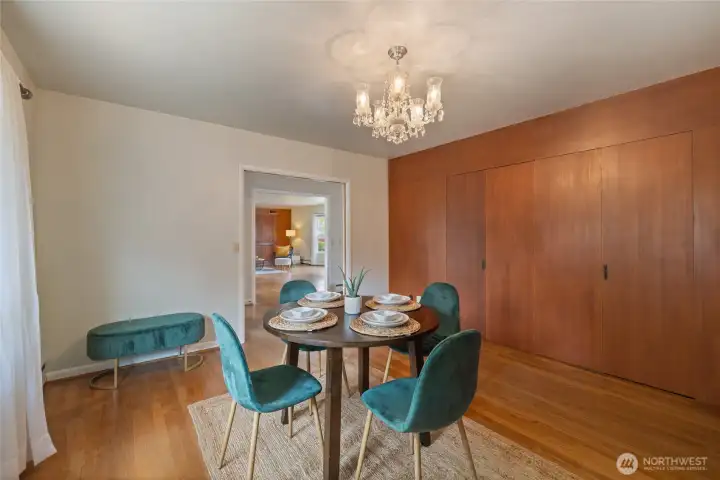 Formal Dinning Room with wood panel storage