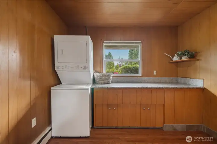 Utility Room with washer and dryer. Counter is plumbed for sink
