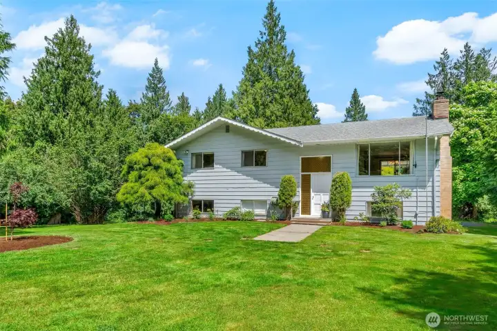 Spacious mid-century on a nearly 1 acre flat lot!