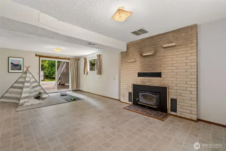 Wood burning fireplace downstairs.