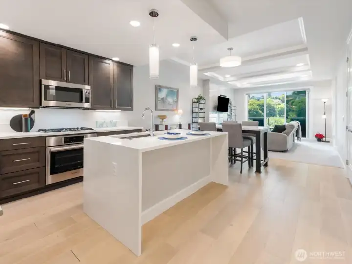 Open-concept living seamlessly connects to the kitchen and fully covered deck. Open-concept living seamlessly connects to the kitchen and fully covered deck.