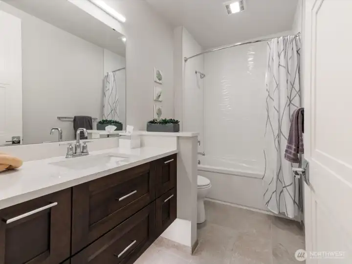 Full guest bath featuring designer tile in shower Full guest bath featuring designer tile in shower