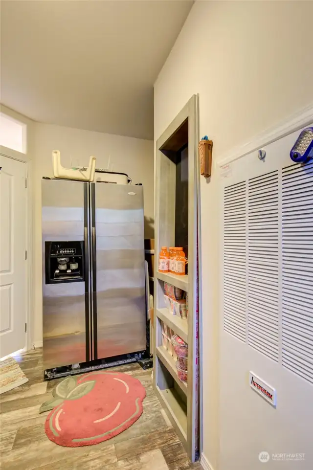 Furnace is propane, water heater is hiden behine the shelving, room for an extra fridge.