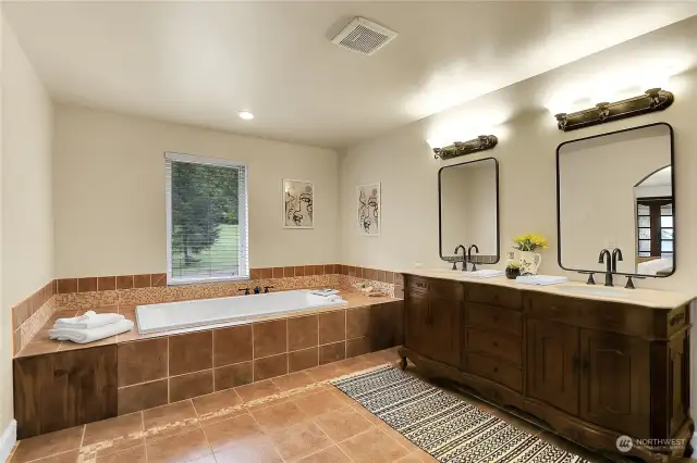 Large primary bathroom with jetted tub.